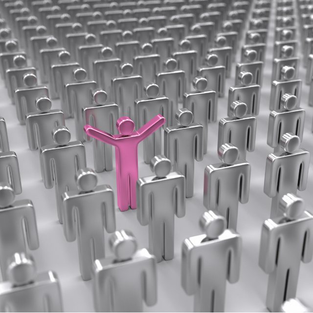 One pink figure standing out among a crowd of silver figures, symbolizing personalized guidance